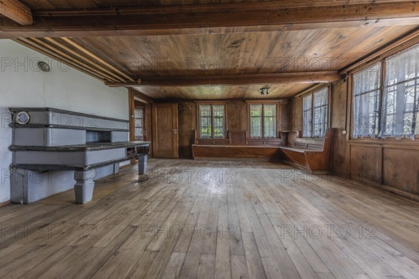 The living room with tiled stove and wooden corner bench in a house built around 1750 that has since been demolished. Menznau, Lucerne, Switzerland
