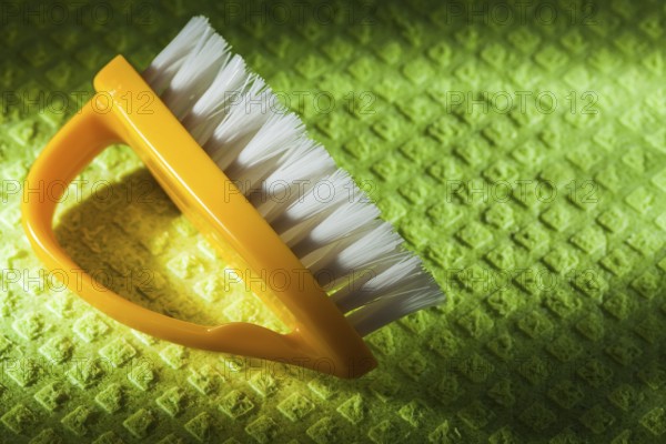 New yellow plastic brush on washcloth