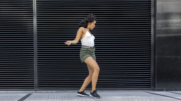 Joyful dancer bringing life to the urban backdrop