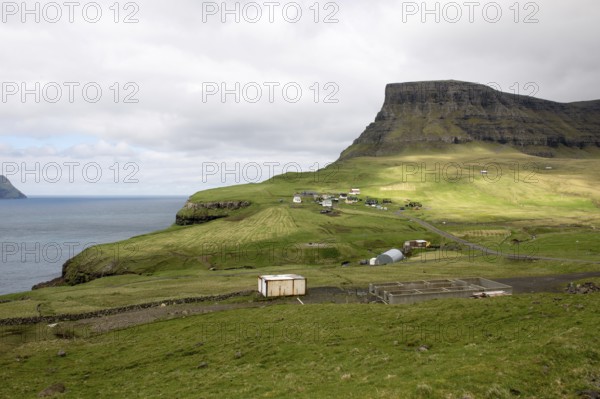 Gasadalur on the Faroe Islands as seen from the street leading towards the village on Vagar, Gasadalur, Faroe Islands, Denmark