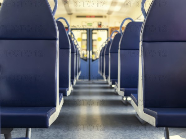 An empty train car with new blue leather seats