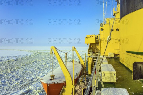 Unforgettable excursion to the arctic tourist cruise. Arctic in winter. Excursion to the Arctic sea icebreaker. Dim northern sun. The concept of active and extreme tourism