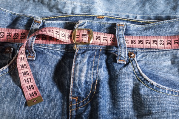 Jeans and centimeter. Belt with buckle
