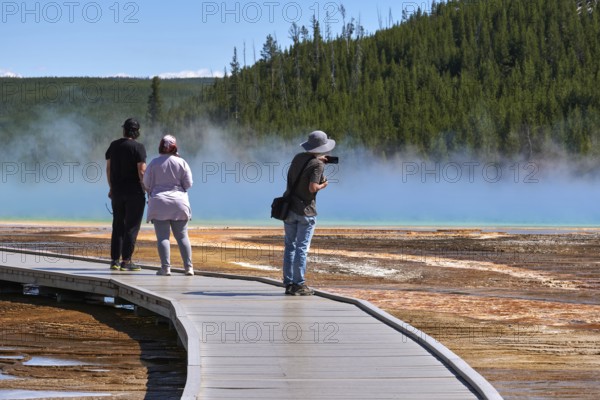 Tourists On Grand Prismatic Spring In Yellowstone National Park, Wyoming, USA, USA