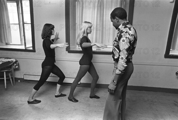 The pop group ABBA. Its two female members Anni-Frid Lyngstad and Agnetha Fältskog practice and train in preparation for the upcoming folk park tour in 1975. Choreographer Graham Tainton leads the exercises. He was a choreographer for Abba. 1975