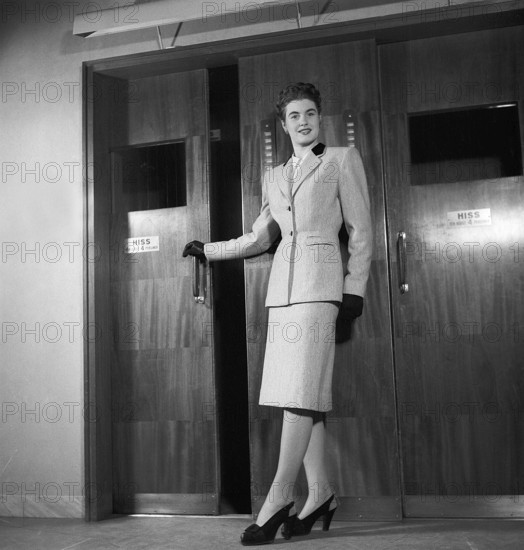 Women's fashion in the 1940s. A young woman in a typical 1940s outfit with a matching skirt and jacket. Sweden 1946 Kristoffersson Ref Y69-1