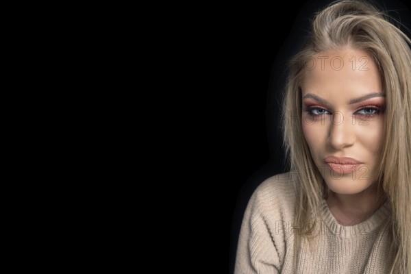 Sensual beautiful blonde woman, beautiful blue-eyed woman. Professional Make-up