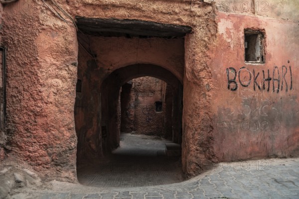 A low narrow public passage in the medina of Marrakech, Morocco