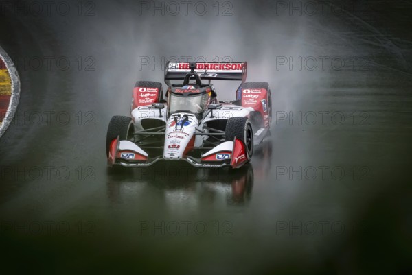 GRAHAM RAHAL (15) of New Albany, Ohio comes through turn 12 (Canada Corner) during a wet practice session for the XPEL Grand Prix at Road America in Elkhart Lake, WI