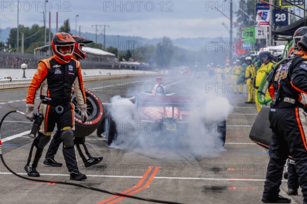 INDYCAR Series driver, BENJAMIN PEDERSEN (R) (55) of Copenhagen, Denmark, brings his car in for service during the Bitnile.com Grand Prix of Portland at Portland International Raceway in Portland OR
