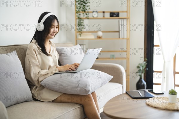 Start up Confident young asian business woman working in webcam group video call conference technology