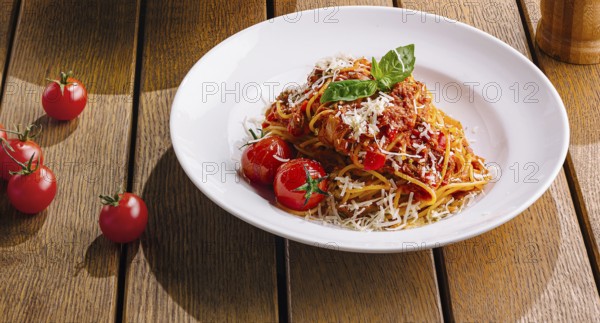 Food, Pasta dish beautifully presented on a warm, wood table setting, evoking a cozy italian dining atmosphere