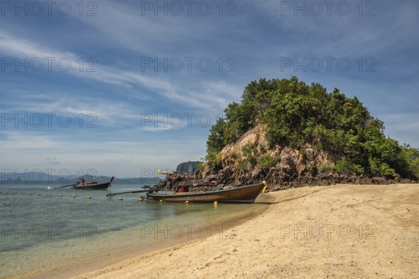Tropical islands view with long tail boat ocean blue sea water and white sand beach at Koh Phak Bia, Krabi Thailand nature landscape