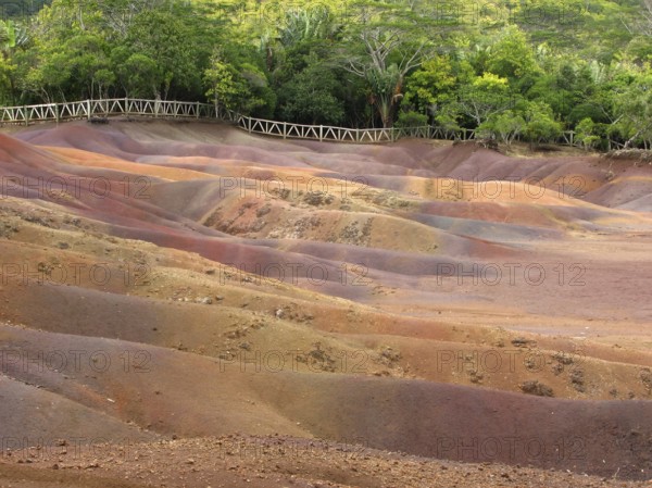 Earth that shines strangely in different colours, it is of volcanic origin, and the colour results from the erosion of the exposed old volcanic ash. A strange natural phenomenon of the coloured earth of Chamarel, Mauritius