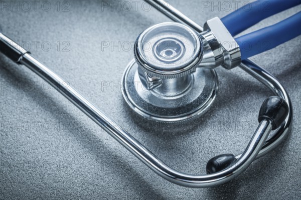 Auscultator on grey background medicine concept