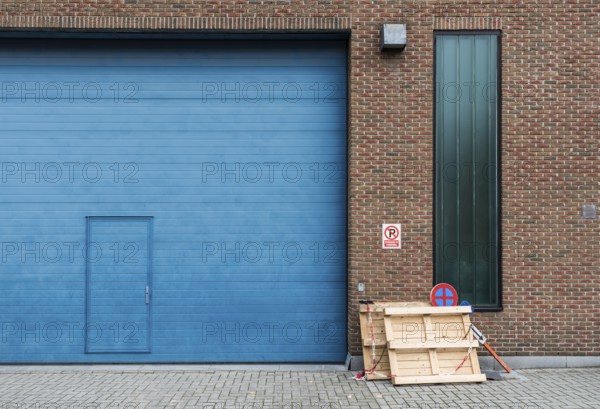Jette, Brussels Capital Region, Belgium, 12 20 2019 Ugly blue Industrial garage port