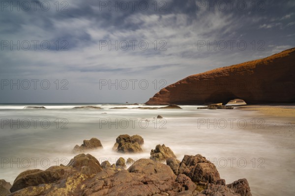 A long exposure view of the beach and rock arch at Legzira on the Atlantic Coast of Morroco