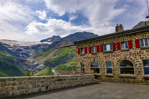 Terrace and Restaurant View over Beautiful Mountain Alp Grüm with Glacier and Alpine Lake Palü in a Cloudy Summer Day in Poschiavo, Bernina, Grisons, Switzerland