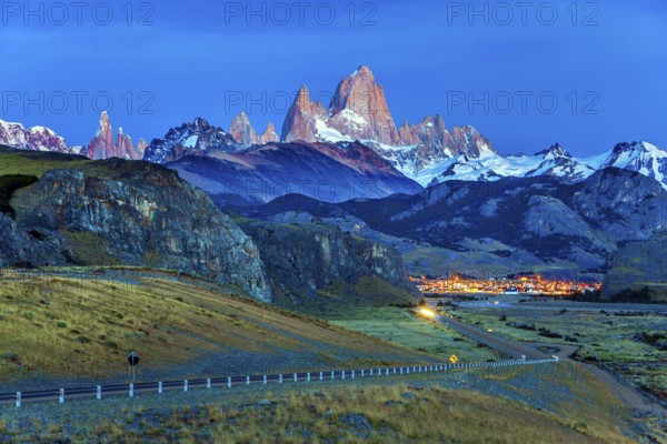 Early morning in the village of El-Chalten. Mountain peak in Patagonia. The grand crimson dawn over the mountain range Fitzroy. The concept of extreme, active and photo tourism