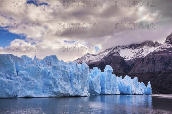 Giant icebergs and ice floes broken away from the shore of the glacier. Grey Lake in the national park Torres del Paine, Chile