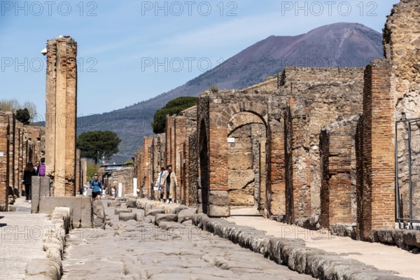 POMPEII, ITALY, MAY 04, 2022, Scenic view of ancient Pompeii, the Vesuvius volcano threatening in the background, Southern Italy