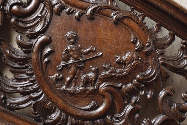 Residential house Zum goldenen Helm, cantilevered oak staircase, balustrade with cartouches. Depictions of putti at the drapery: The wool (shepherd and sheep)