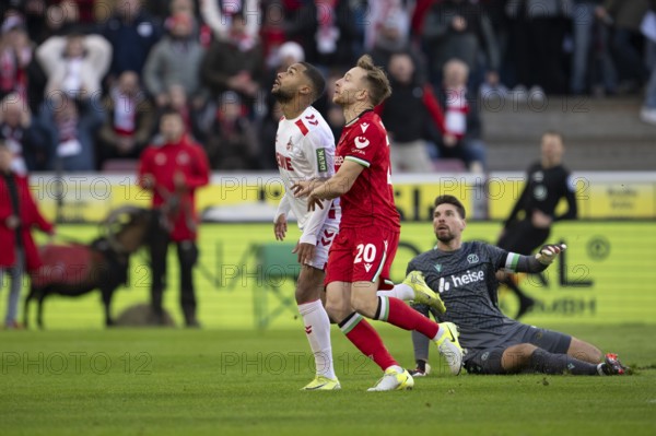 (DFL/DFB REGULATIONS PROHIBIT ANY USE OF PHOTOGRAPHS AS IMAGE SEQUENCES AND/OR QUASI-VIDEO) Cologne, RheinEnergieStadion, North Rhine-Westphalia, Linton Maina (1.FC Köln, midfield, #37), Jannik Dehm (defence, Hannover 96, #20), Ron-Robert Zieler (goalkeeper, Hannover 96, #1), 2nd Bundesliga, 1.FC Köln, Hannover 96 on 30.11.2024 at RheinEnergieStadion in Cologne Germany