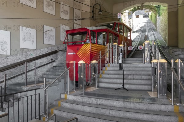 Upper city funicular line in Bergamo (Funicolare Citta Alta). Red funicular connects old Upper City and new. Bergamo (upper town), ITALY - August 19, 2020