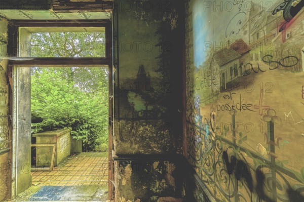 An abandoned room with dilapidated walls and an open door leading to nature, Château d'Ah, Lost Place, Andenne, Province of Namur, Belgium