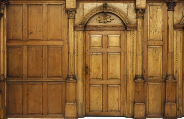 Wooden paneled wall and an arched door Victorian architecture style interior