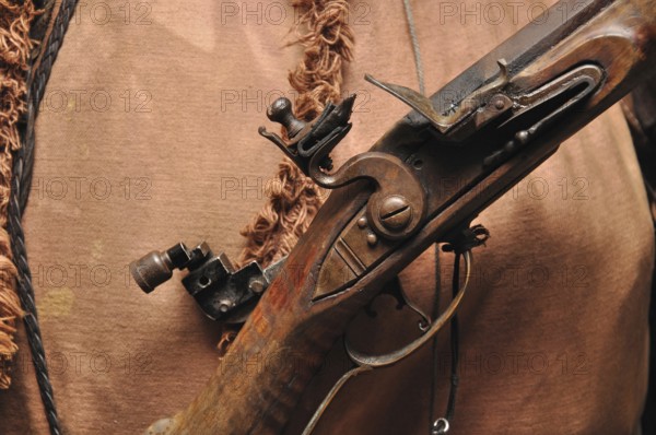 Mechanism of a blackpowder flintlock rifle