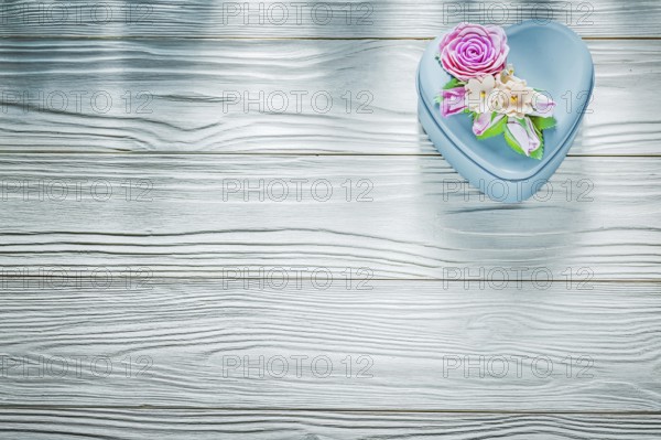 Metal present box on wooden board holidays concept