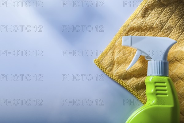 Sprayer cleaning washcloth on white background