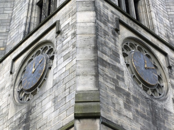 The tower of church of saint johns in leeds a seventeenth century church showing two old clocks