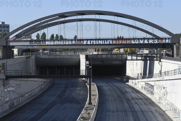 Construction site of the A100 motorway at the connection to Sonnenallee near the Estrel Hotel in Berlin-Neukölln. The lettering on the railway bridge reads Black lives matter Feminism is for lovers