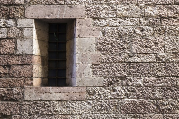 Assisi Italy : Window on medieval stone wall