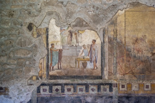 POMPEII, ITALY, MAY 04, 2022, Scenic painting of Roman inhabitants in a fresco of an ancient Roman villa in Pompeii, Southern Italy