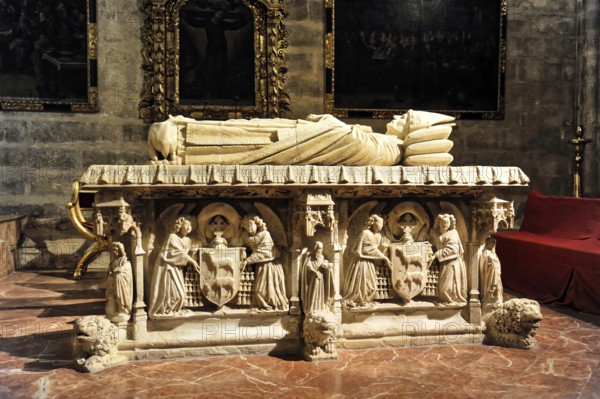 Cathedral of Santa María de la Sede in Seville, Andalusia, Spain, Magnificent stone tomb in a church, decorated with detailed medieval reliefs and columns, Seville, Andalusia, Spain