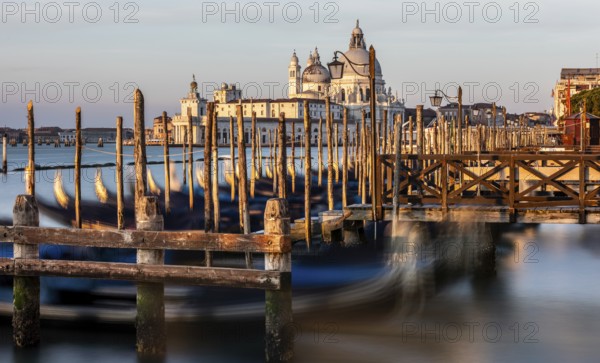 Gondola jetty, Venetian gondolas with the church of Santa Maria della Salute in the background, Venice, UNESCO World Heritage Site, Veneto, Italy