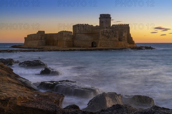 Le Castella, Italy, 11 December, 2023: view of the Le Castella fortress in Isola di Capo Rizzuto at sunset