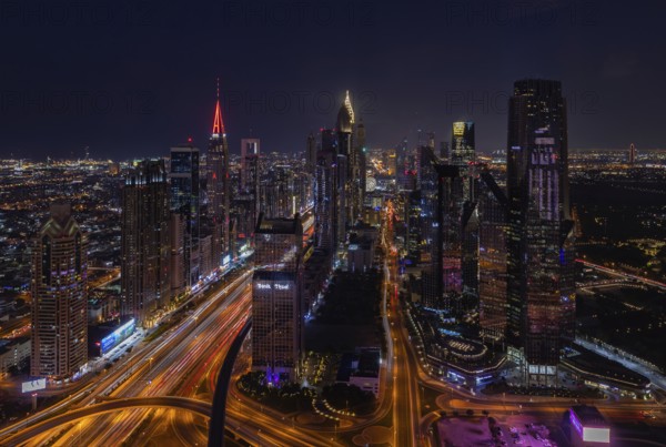 A picture of the tall buildings at the Trade Centre district at night