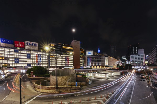 Shinjuku, Japan, 18 May 2019: Shinjuku station with bus terminal in Tokyo?s busy Shinjuku neighborhood at night