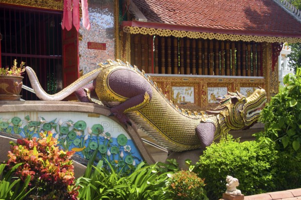 The Mon, a non-Tai group, were resettled in Chiang Mai at the beginning of the 19th century. They were traditionally hostile to the ruling Bamar people of Burma, and therefore generally considered to be natural allies of the Tai, whether in Lan Na, or further to the south in Siam.<br/><br/> The Mon, often associated with water and boats (notably in their main Bangkok areas of settlement at Pak Kret and Phra Padaeng), were settled around Wat Chai Mongkhon on the west bank of the River Ping just north of Charoen Prathet Soi 9. Today, however, there is precious little to suggest a Mon connection with this wealthy and rather over-elaborate temple which clearly receives substantial donations from the city's wealthy Sino-Thai community. It is interesting to note that Mon often worked as boatmen in this area, and that today ‘river trips' on the Maenam Ping start and end at the Wat Chai Mongkhon river landing