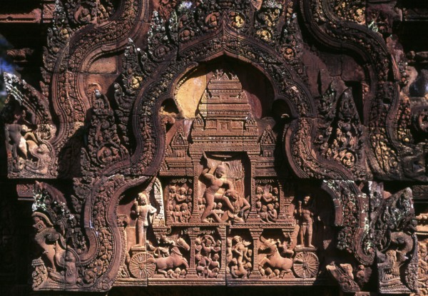 Banteay Srei (or Banteay Srey) is a 10th century Cambodian temple dedicated to the Hindu god Shiva and is located to the north-east of the main group of temples at Angkor. Banteay Srei is built largely of red sandstone, a medium that lends itself to the elaborate decorative wall carvings which are still observable today. Banteay Srei is sometimes referred to as the jewel of Khmer art
