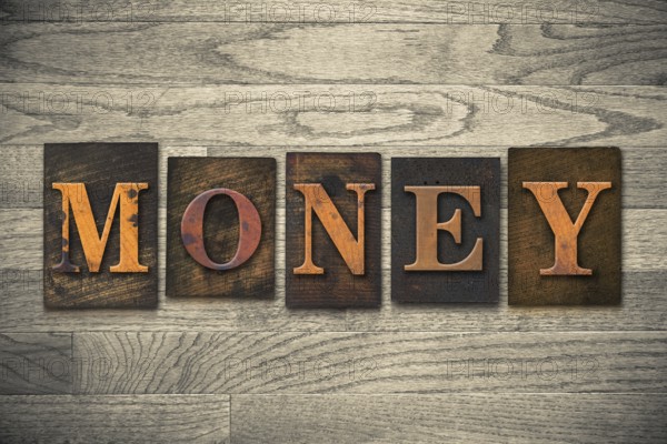 The word MONEY written in vintage wooden letterpress type