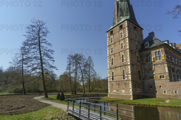 Historic castle with high tower, small bridges and water channels, raesfeld, münsterland, germany