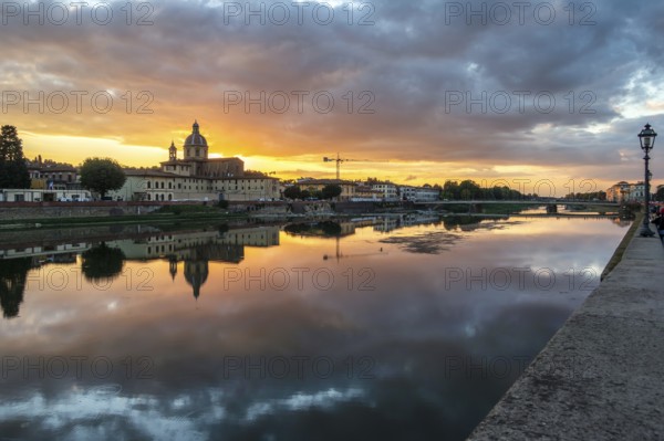 FLORENCE, TUSCANY/ITALY - OCTOBER 19 : View of buildings along the River Arno at dusk in Florence on October 19, 2019
