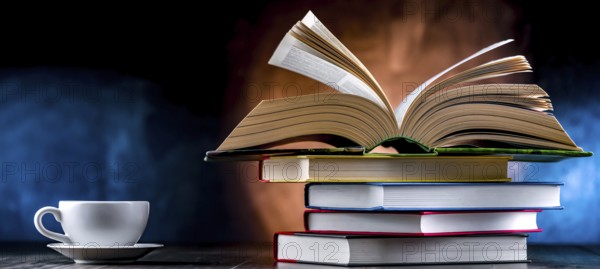 A composition with books and a cup of coffee