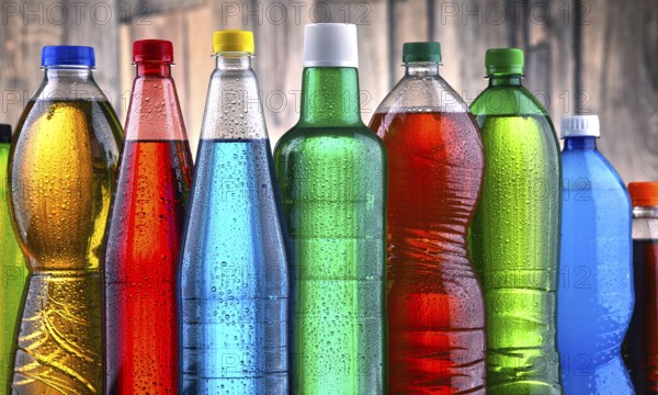 Plastic bottles of assorted carbonated soft drinks in variety of colors