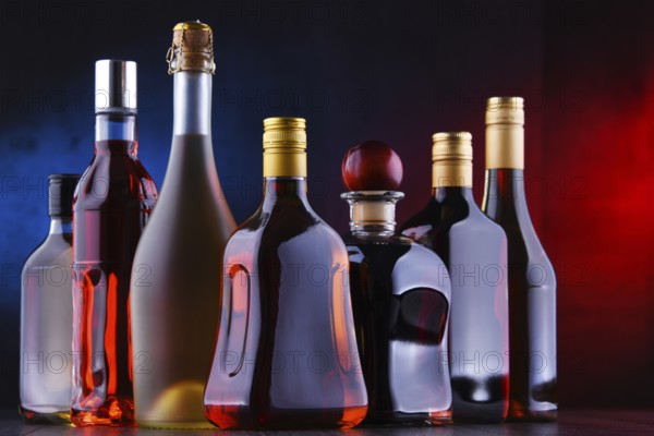 Composition with bottles of assorted alcoholic beverages